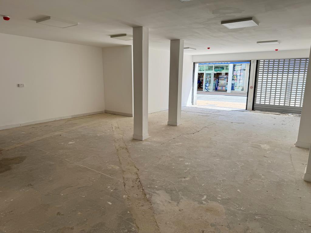 Lot: 122 - TOWN CENTRE LOCK-UP SHOP FOR INVESTMENT OR OWNER OCCUPATION - Looking from towards the back of the Shop with High Street Visible